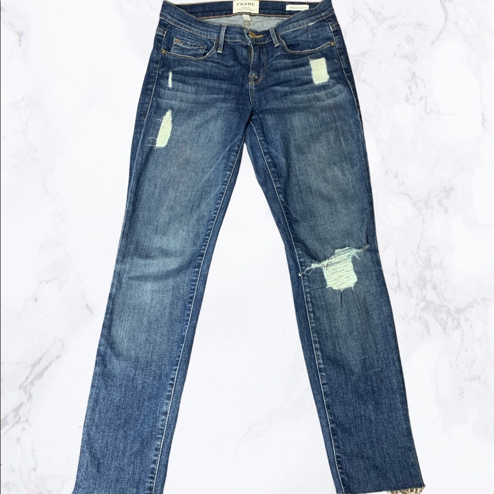 Frame skinny distressed jeans.